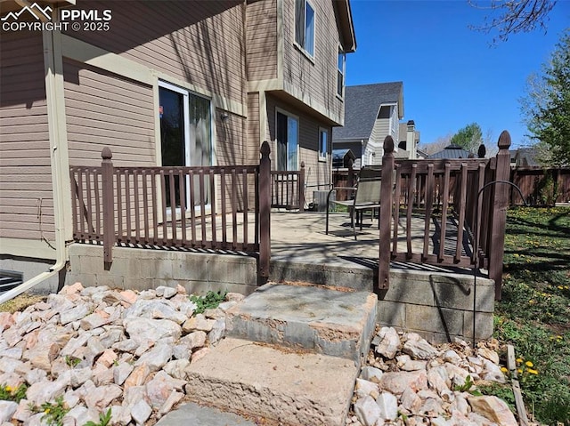 9367 Peaceful Meadow St, Colorado Springs, CO 80925 - wooden deck featuring a patio