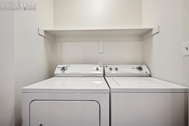 washroom with laundry area and washer and clothes dryer