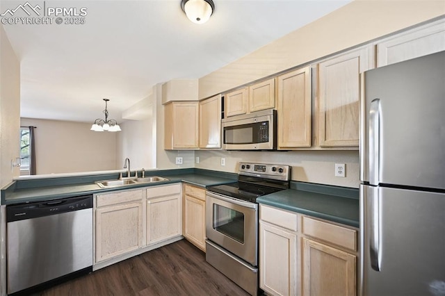 kitchen with a sink, appliances with stainless steel finishes, light brown cabinetry, and dark wood-style floors
