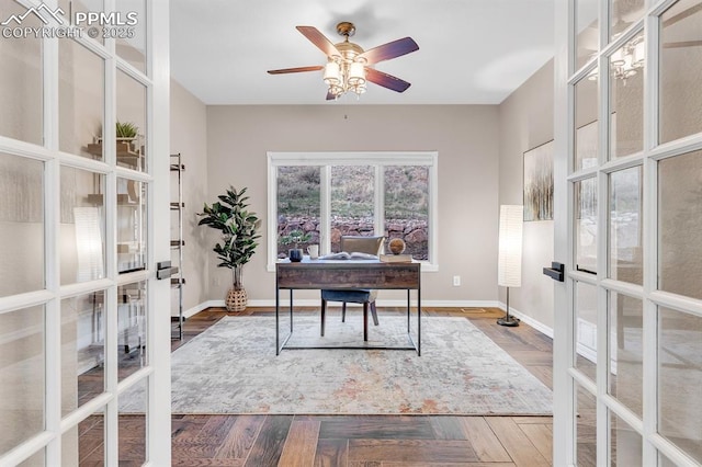office space featuring baseboards, a ceiling fan, and french doors