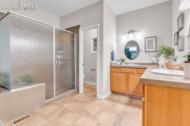 full bathroom with visible vents, vanity, toilet, and a shower stall