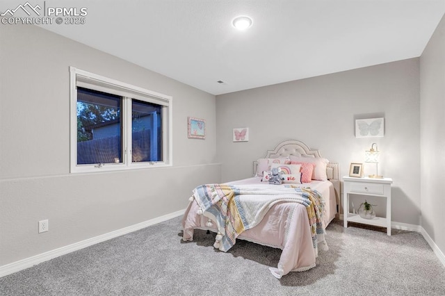 bedroom featuring baseboards and carpet flooring