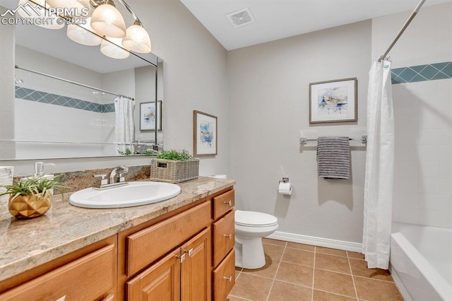 full bath with visible vents, vanity, toilet, baseboards, and tile patterned floors