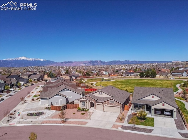 drone / aerial view with a mountain view and a residential view