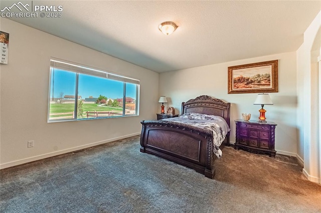 carpeted bedroom with baseboards