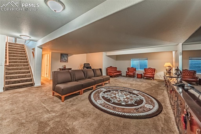 carpeted living area featuring a textured ceiling and stairway