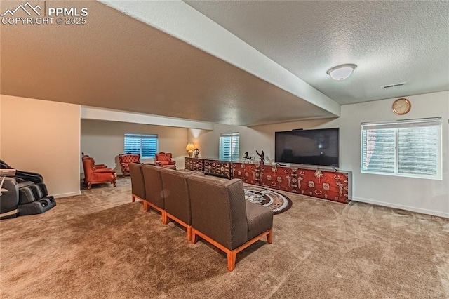living room with carpet, visible vents, and a healthy amount of sunlight