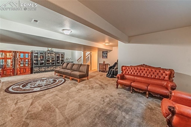 living room featuring carpet, stairway, and visible vents