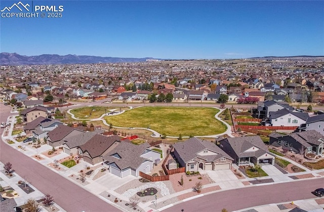 drone / aerial view featuring a mountain view and a residential view