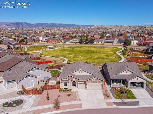 birds eye view of property featuring a mountain view and a residential view