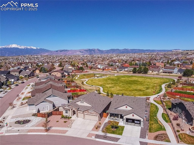 aerial view featuring a mountain view and a residential view