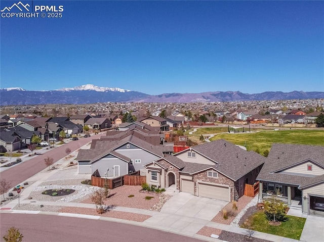 aerial view with a mountain view and a residential view