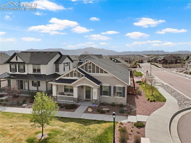 6471 Cisco Kid Way, Colorado Springs, CO 80923 - craftsman-style home featuring roof with shingles, stucco siding, a porch, a mountain view, and a residential view
