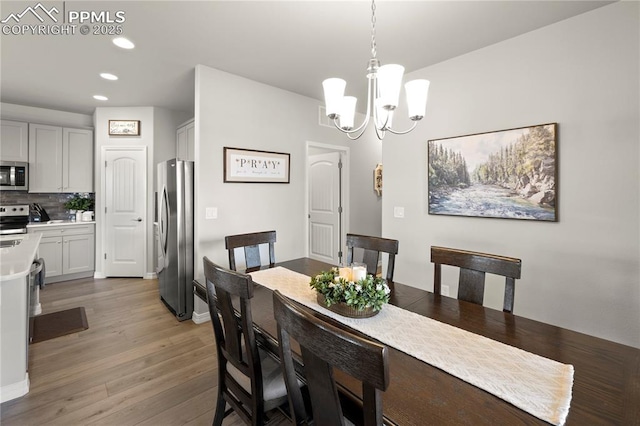 6471 Cisco Kid Way, Colorado Springs, CO 80923 - dining space featuring recessed lighting, baseboards, a chandelier, and light wood-style flooring