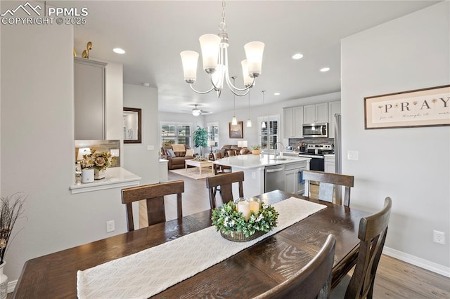 6471 Cisco Kid Way, Colorado Springs, CO 80923 - dining space featuring recessed lighting, baseboards, a notable chandelier, and light wood finished floors