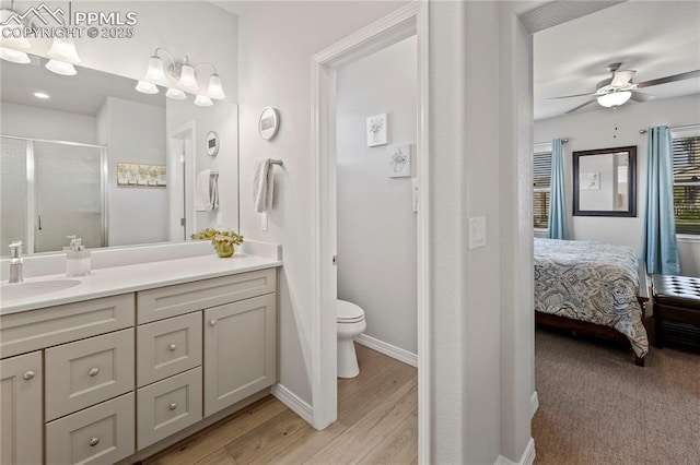 6471 Cisco Kid Way, Colorado Springs, CO 80923 - full bath featuring vanity, toilet, baseboards, a shower stall, and a ceiling fan