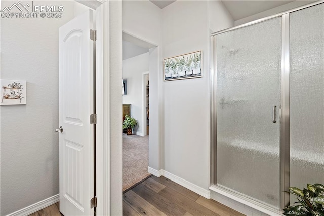 6471 Cisco Kid Way, Colorado Springs, CO 80923 - full bathroom with baseboards, wood finished floors, and a shower stall