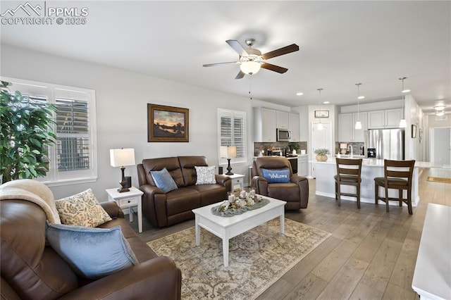 6471 Cisco Kid Way, Colorado Springs, CO 80923 - living room featuring a ceiling fan, recessed lighting, and light wood-type flooring