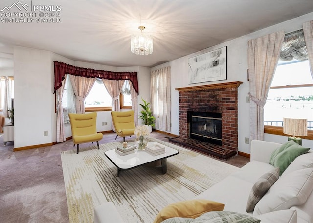 6185 Sayres Rd, Colorado Springs, CO 80927 - living area featuring a brick fireplace, baseboards, and a notable chandelier