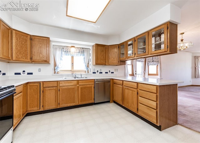 6185 Sayres Rd, Colorado Springs, CO 80927 - kitchen featuring a peninsula, brown cabinets, black electric range, a sink, and dishwasher
