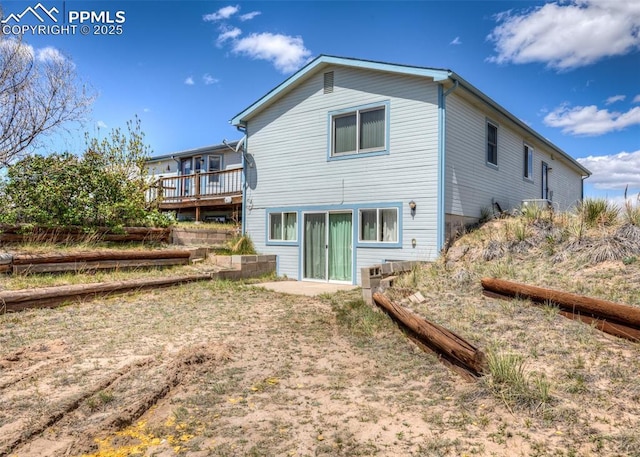 6185 Sayres Rd, Colorado Springs, CO 80927 - back of property with a wooden deck