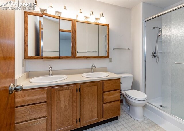 6185 Sayres Rd, Colorado Springs, CO 80927 - bathroom with double vanity, a sink, tile patterned floors, and a shower stall