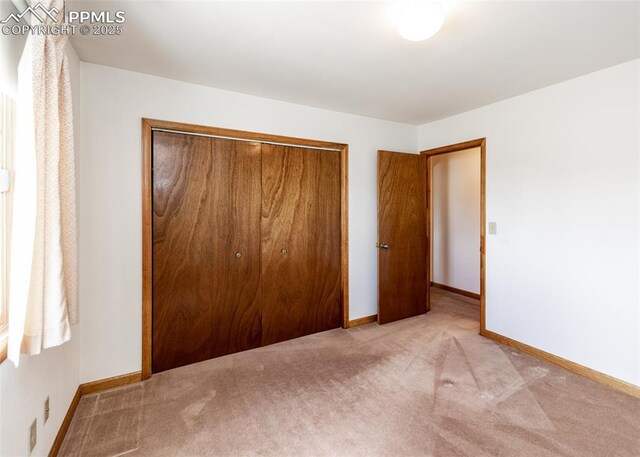 6185 Sayres Rd, Colorado Springs, CO 80927 - unfurnished bedroom featuring carpet floors, baseboards, and a closet