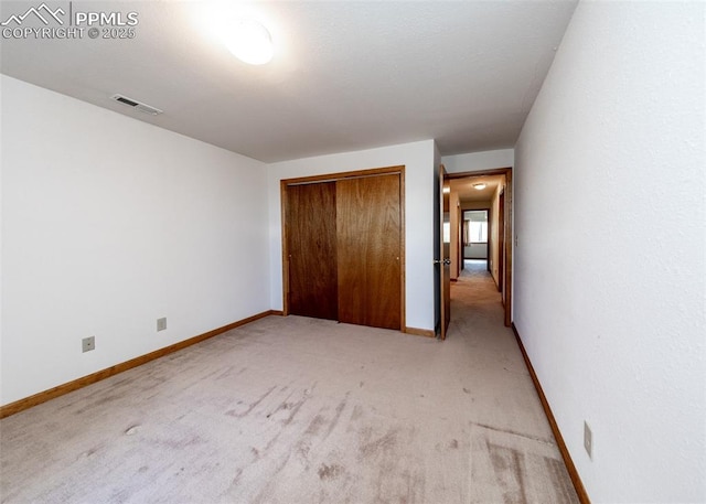 6185 Sayres Rd, Colorado Springs, CO 80927 - unfurnished bedroom featuring light colored carpet, baseboards, visible vents, and a closet