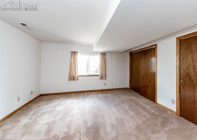 6185 Sayres Rd, Colorado Springs, CO 80927 - unfurnished bedroom featuring baseboards, carpet floors, two closets, and visible vents