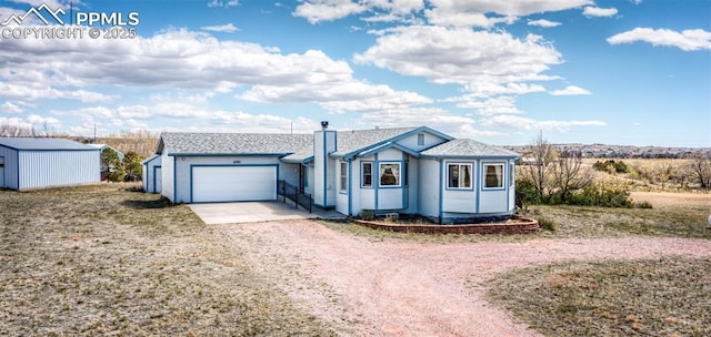 6185 Sayres Rd, Colorado Springs, CO 80927 - single story home with a garage, dirt driveway, and a chimney