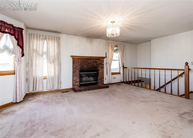6185 Sayres Rd, Colorado Springs, CO 80927 - unfurnished living room with a healthy amount of sunlight, carpet, and a chandelier