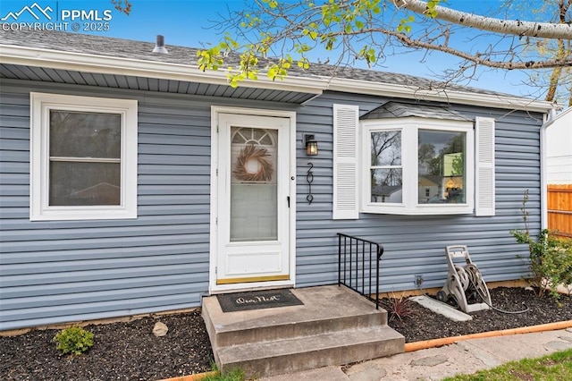 doorway to property with fence