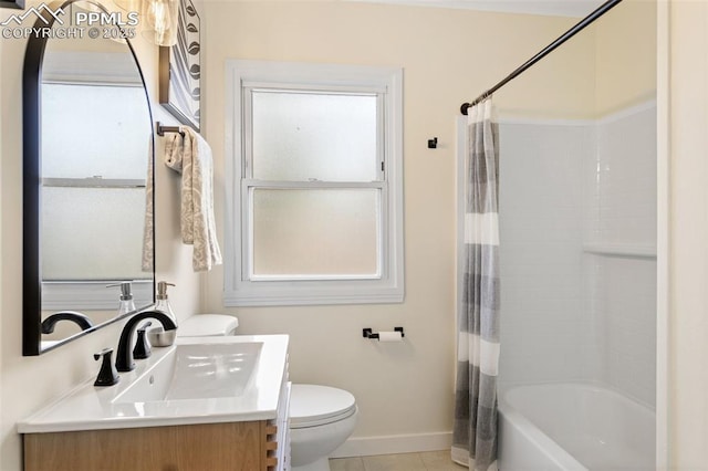 full bathroom featuring baseboards, a wealth of natural light, toilet, and vanity