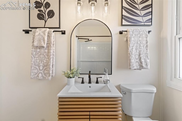 full bathroom with vanity and toilet