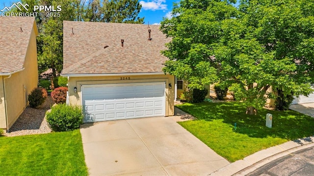 3245 Chestnut Glen Ln, Colorado Springs, CO 80918 - view of front of house featuring a front yard, roof with shingles, driveway, a garage, and stucco siding