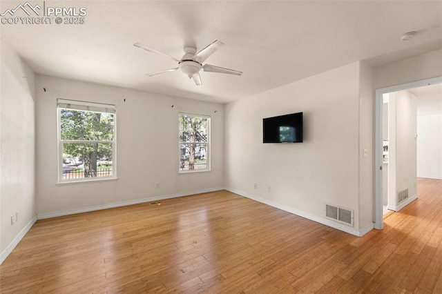 3245 Chestnut Glen Ln, Colorado Springs, CO 80918 - empty room with a ceiling fan, healthy amount of natural light, light wood finished floors, and a smoke detector