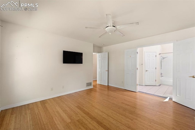 3245 Chestnut Glen Ln, Colorado Springs, CO 80918 - unfurnished bedroom with light wood-style flooring, ensuite bathroom, and a ceiling fan
