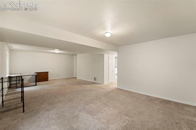 3245 Chestnut Glen Ln, Colorado Springs, CO 80918 - finished below grade area featuring light colored carpet and a textured ceiling
