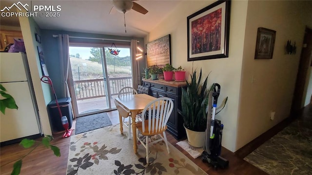 dining room featuring ceiling fan and wood finished floors