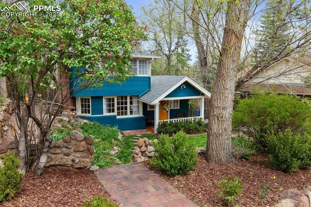 25 Highland St, Colorado Springs, CO 80906 - view of front of house with a porch and roof with shingles