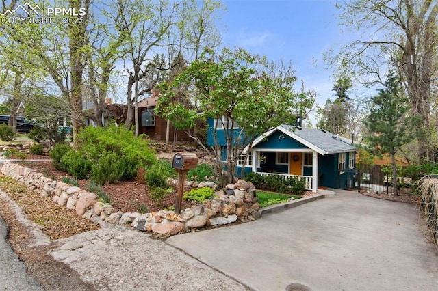 25 Highland St, Colorado Springs, CO 80906 - view of front of property with a porch and driveway