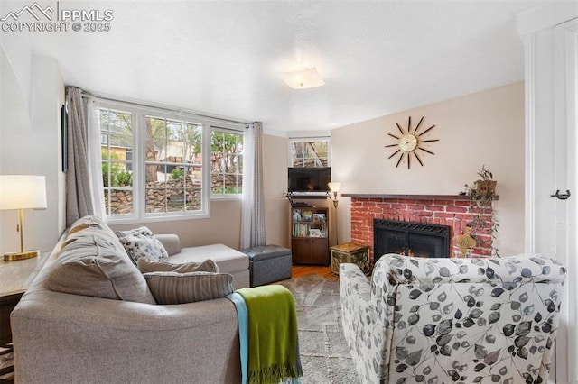 25 Highland St, Colorado Springs, CO 80906 - living area with a brick fireplace and wood finished floors