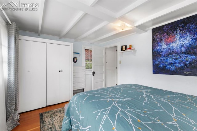 25 Highland St, Colorado Springs, CO 80906 - bedroom with wood finished floors, beam ceiling, and a closet