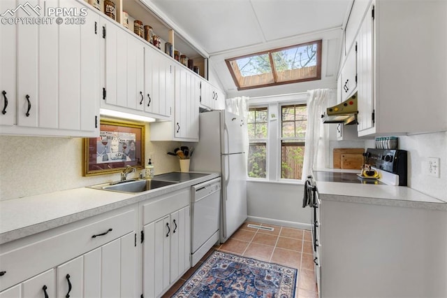 25 Highland St, Colorado Springs, CO 80906 - kitchen with white appliances, a sink, under cabinet range hood, a skylight, and light countertops