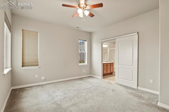 8806 Bella Flora Hts, Colorado Springs, CO 80924 - unfurnished bedroom with light carpet, multiple windows, and baseboards