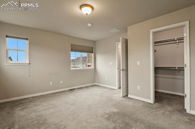 8806 Bella Flora Hts, Colorado Springs, CO 80924 - unfurnished bedroom with carpet flooring, baseboards, a spacious closet, and a closet