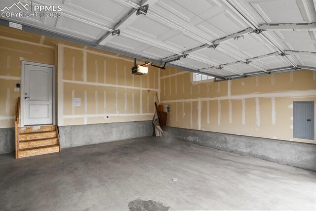 8806 Bella Flora Hts, Colorado Springs, CO 80924 - garage with a garage door opener and electric panel