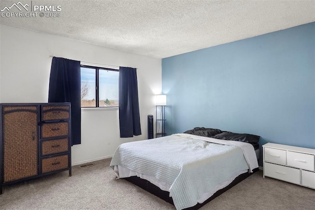 4720 Live Oak Dr, Colorado Springs, CO 80916 - carpeted bedroom with a textured ceiling