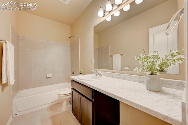 bathroom featuring toilet, tile patterned floors, bathing tub / shower combination, and vanity
