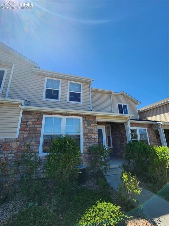 3928 Diamond Ridge Vw, Colorado Springs, CO 80918 - multi unit property with stone siding, central AC unit, and covered porch
